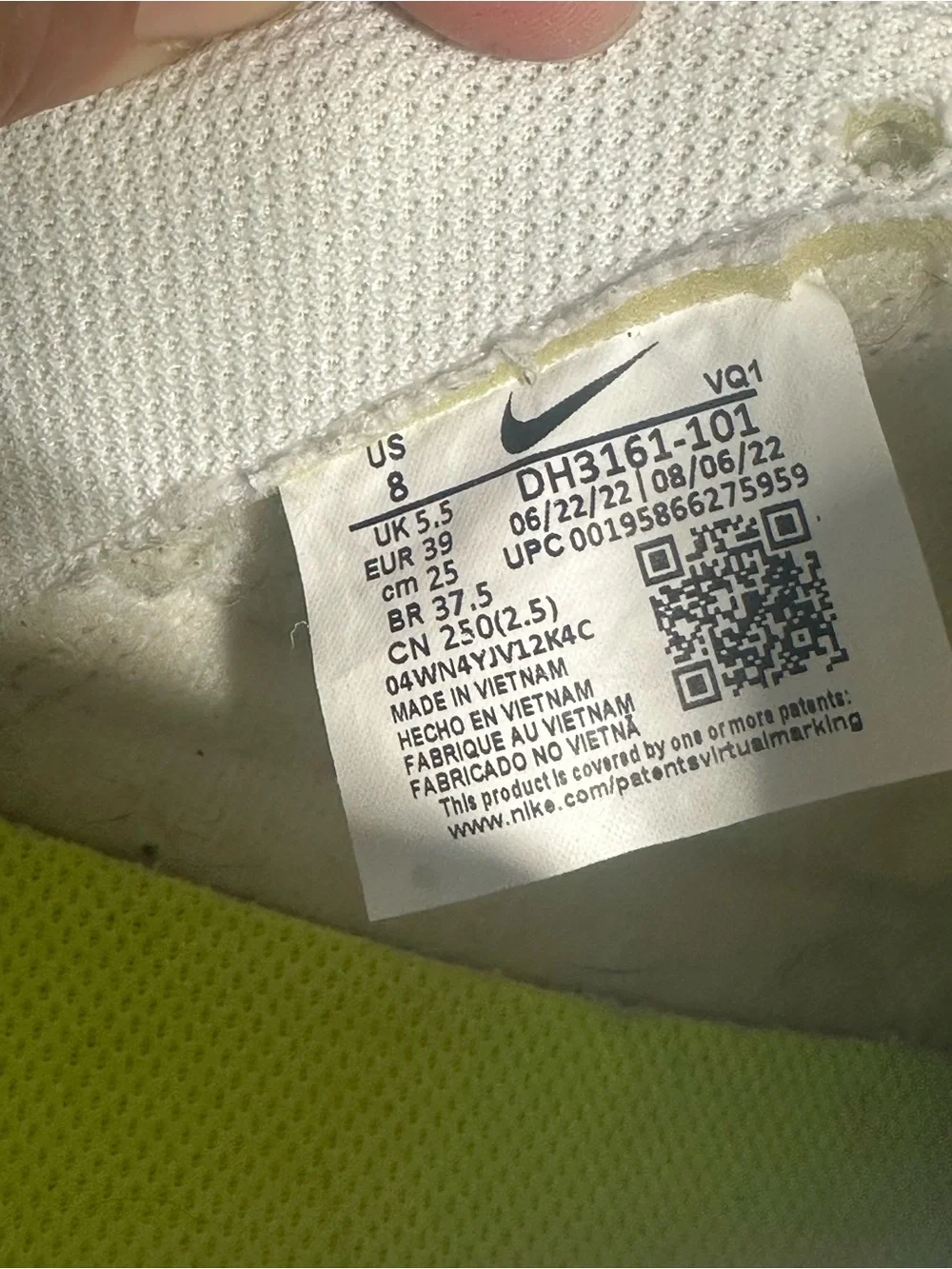Nike White Mid-Top Sneakers with Orange Swoosh